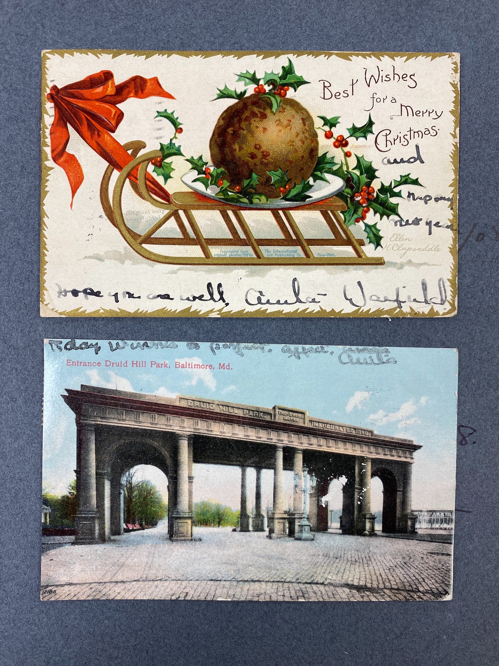 Two Postcard albums - an Edwardian blue album, containing topographical views in Europe and the U.S.A, as collected by Muriel MacGeagh, sister of Col. Sir Henry F. MacGeagh, on the trip to America July 1907-March 1908, t